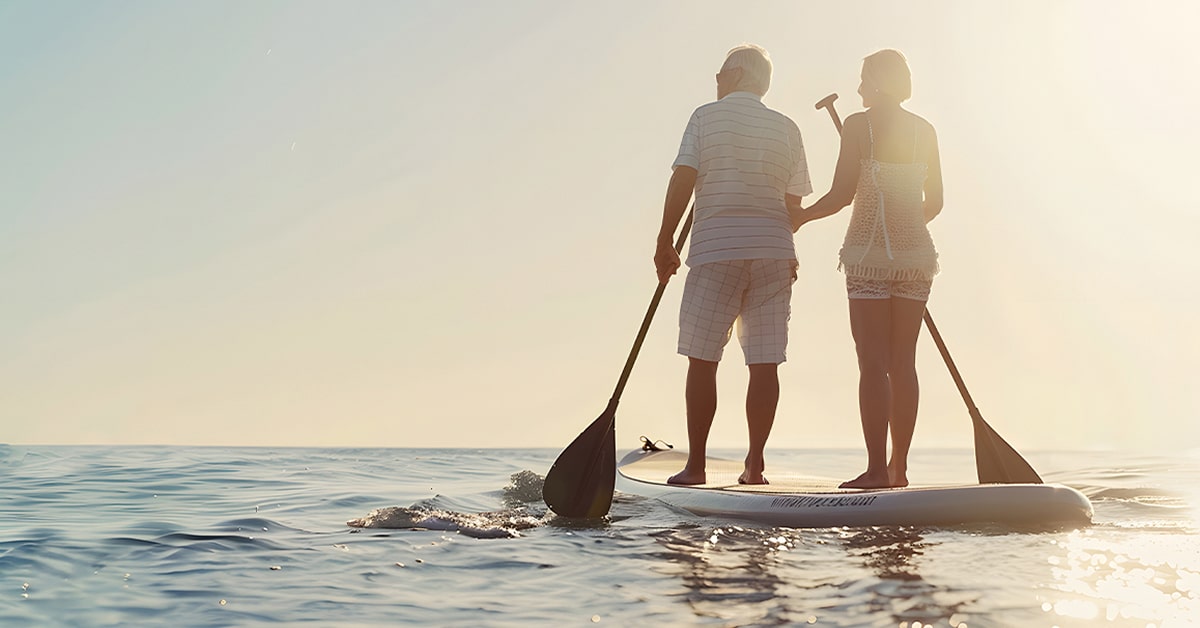 Couple Paddleboarding in the ocean