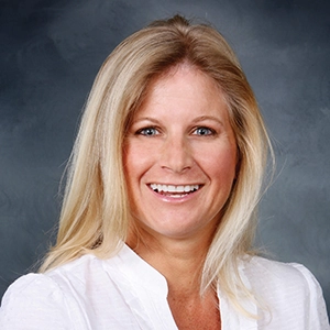 A professional headshot of Michelle Thomas, Team Leader of The Michelle Thomas Team.